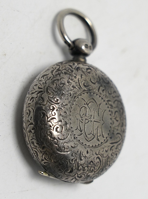 A late Victorian engraved silver sovereign case, Birmingham, 1898, diameter 34mm. Condition - fair